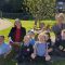 Teachers and pupils sitting outside at Petteril Bank School